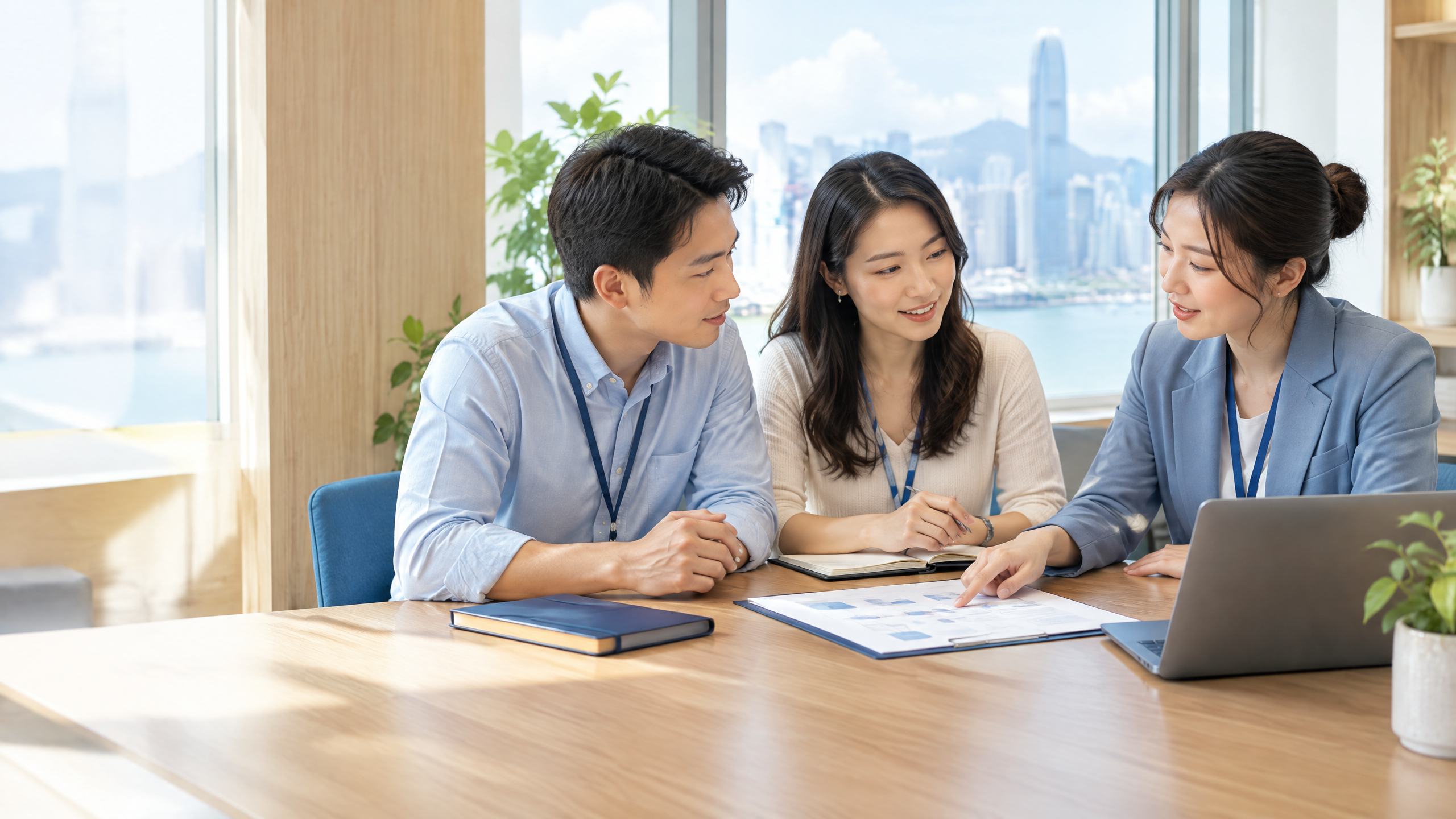 Hong Kong cloud operations team aligning an accountable operating rhythm around a wood meeting table